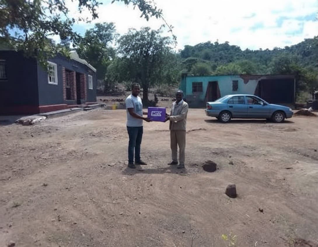 A MyTipKart courier delivering a parcel in Zimbabwe